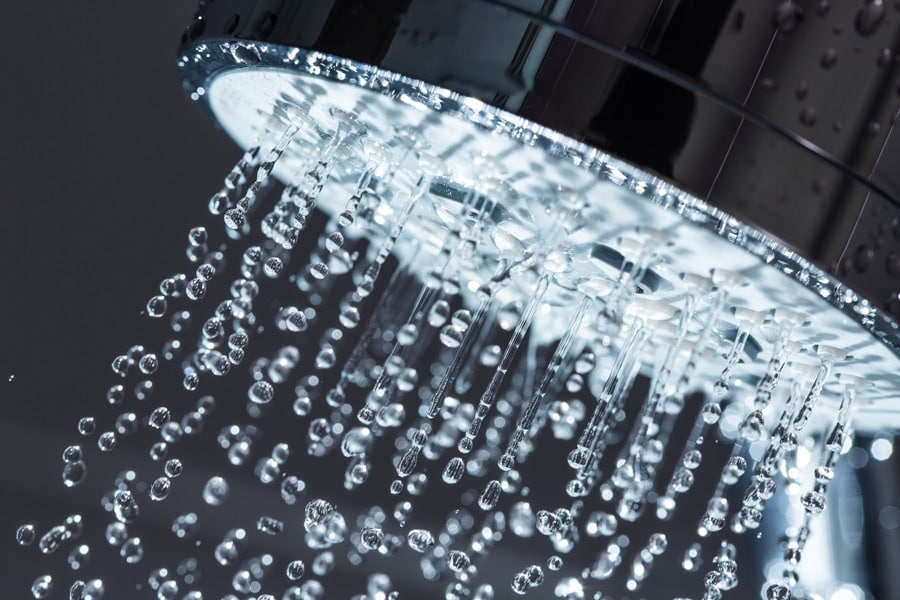 Water flowing freely from showerhead.